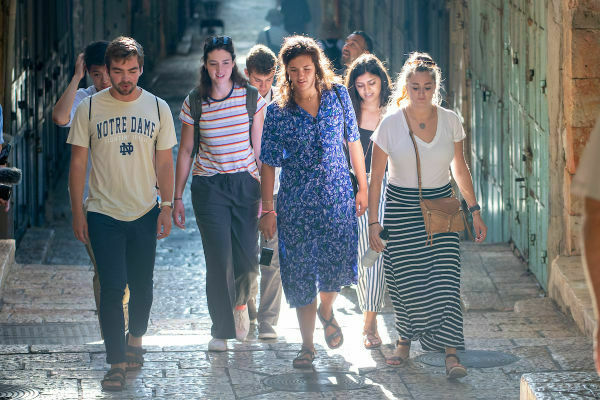 Undergraduate Students Walk With Classmates In The Old City Of Jerusalem