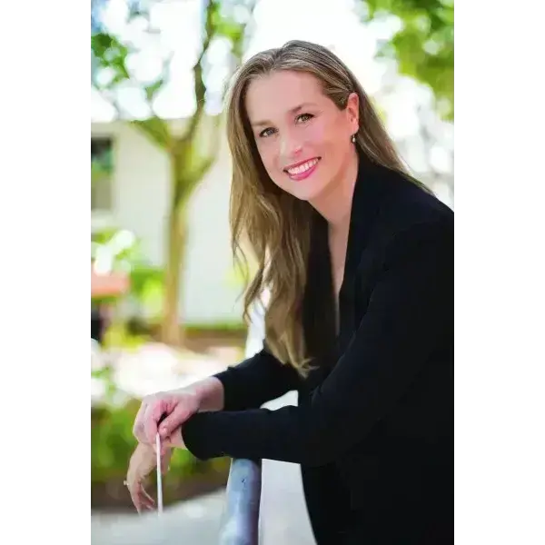 Women smiling with black blazer